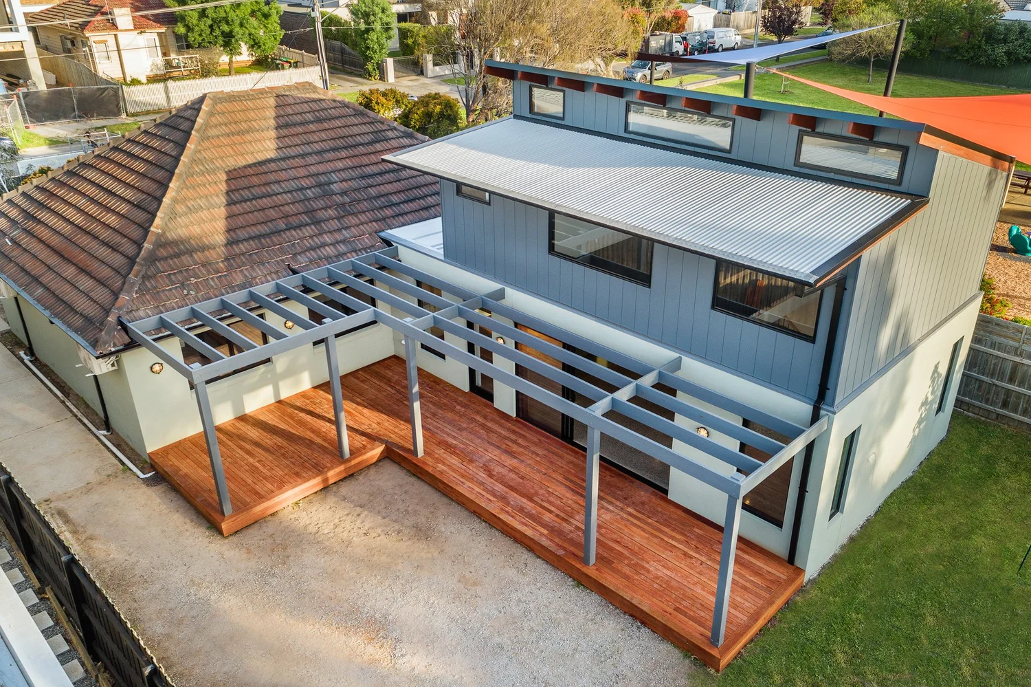 Aerial view of charcoal two-storey extension, pergola and timber deck, Colin Street Bentleigh East
