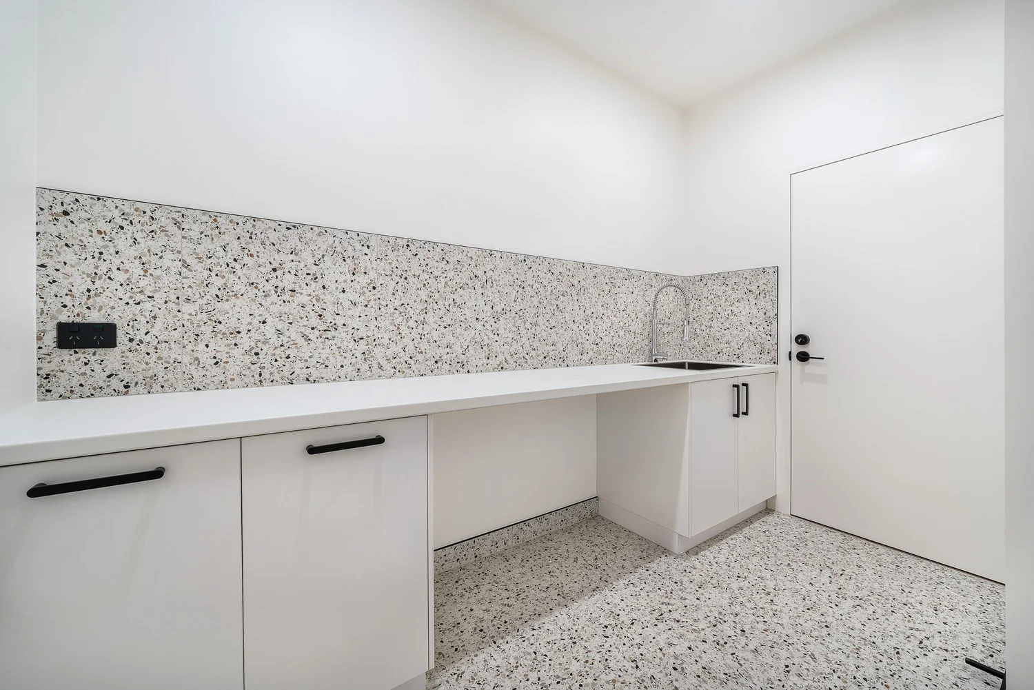 Laundry with custom cabinetry and timber benchtop, Colin Street Bentleigh East — Eco Building Design