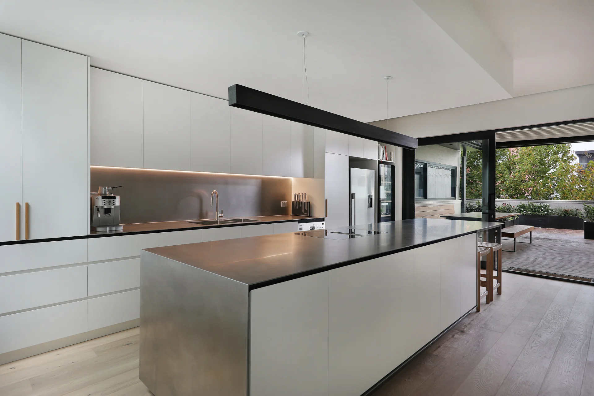 Kitchen with steel island and black blade beam, George Street Fitzroy — Eco Building Design