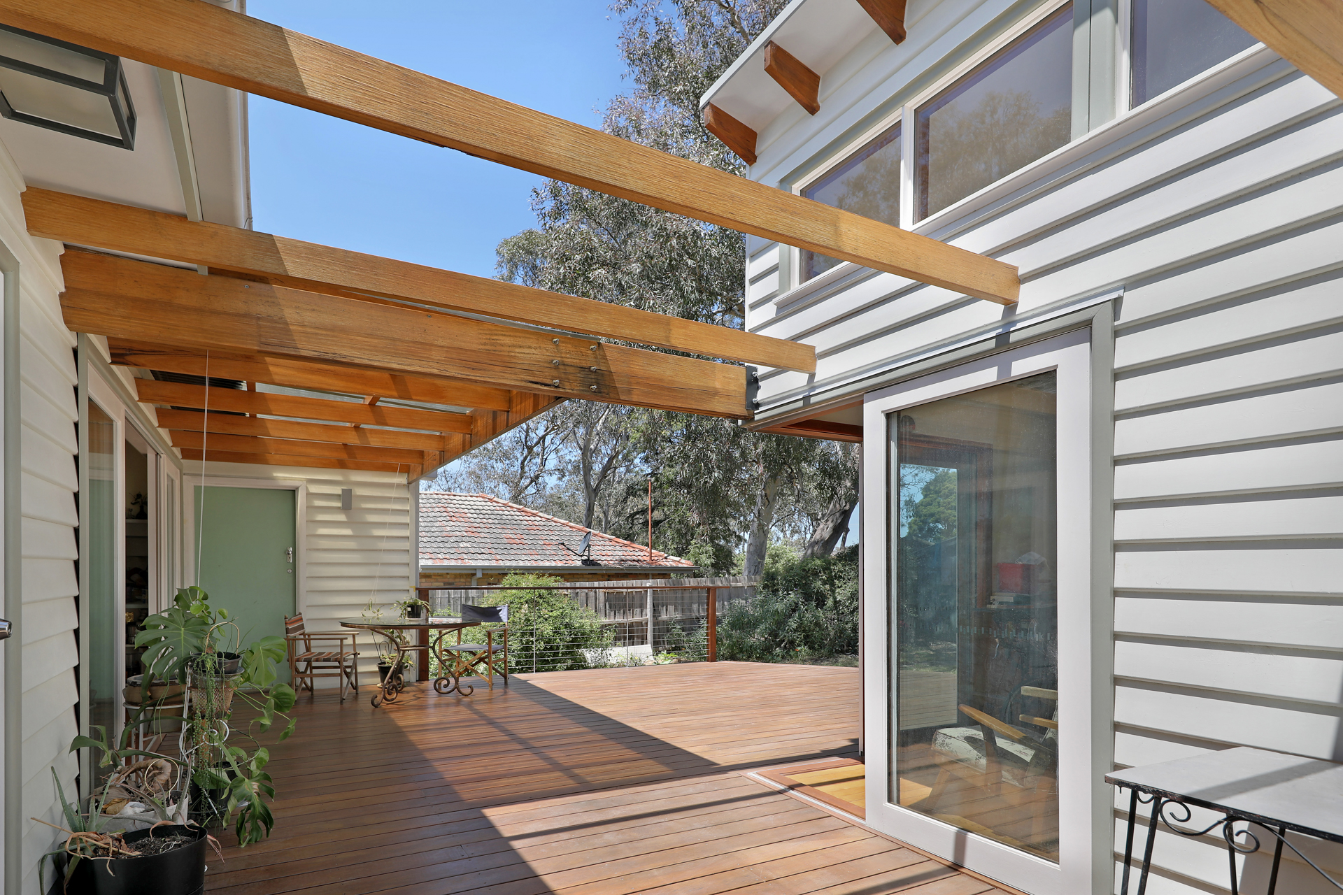 Covered timber deck and pergola extension in Macleod
